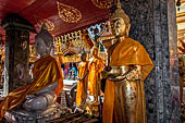 Chiang Mai - Wat Phra That Doi Suthep. The innercourtyard of the temple is filled with Buddha statues and other religious paraphenalia. 